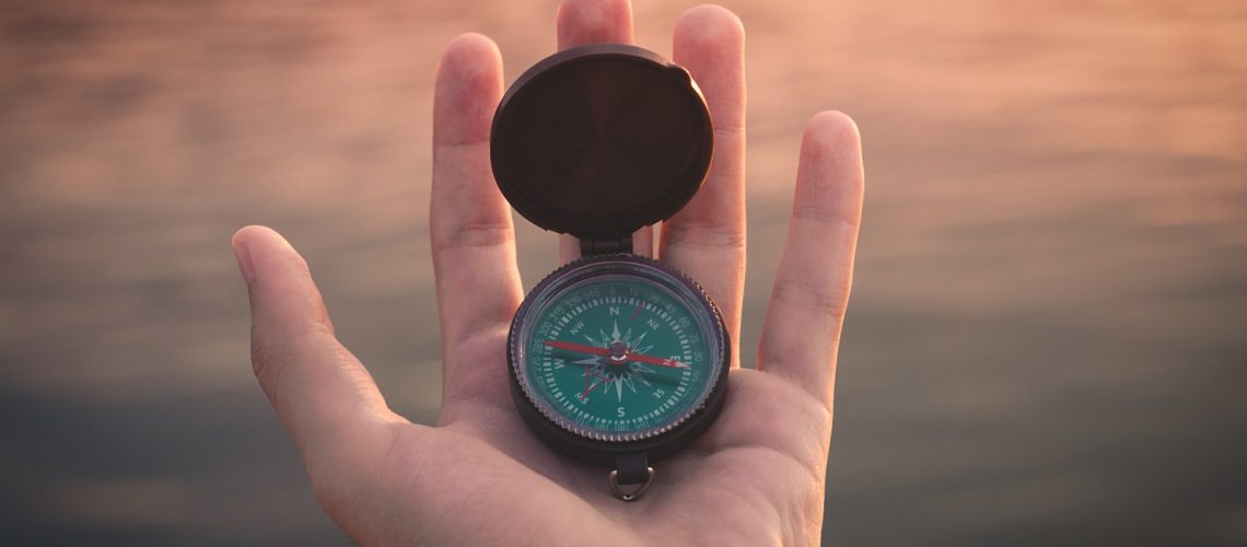 hand-with-compass